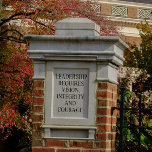 K7617 Fall Campus A pillar outside a building reads "Leadership requires vision, integrity, and courage."