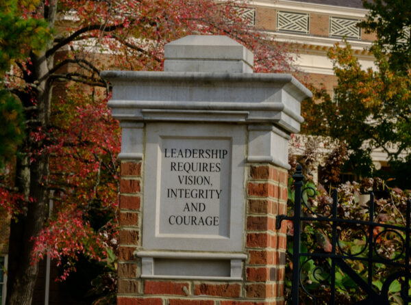 K7617 Fall Campus A pillar outside a building reads "Leadership requires vision, integrity, and courage."