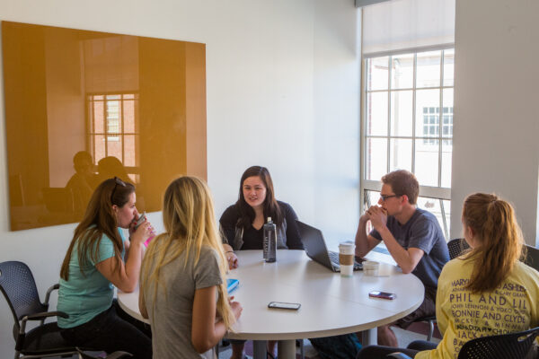 K15414 Armstrong Student Union A group of people sit around a round table having a discussion.